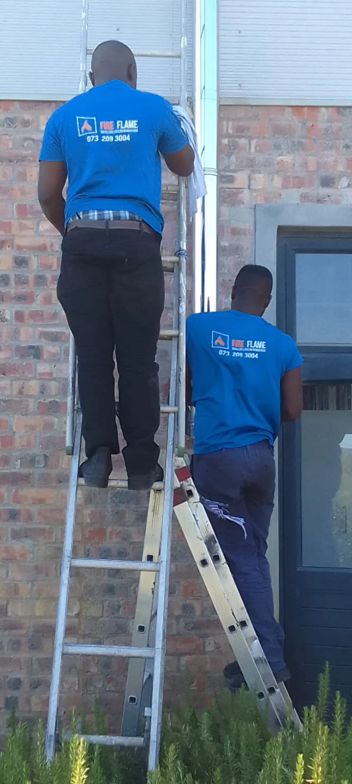 Fire Flames team fitting an exterior flue in Noordhoek
