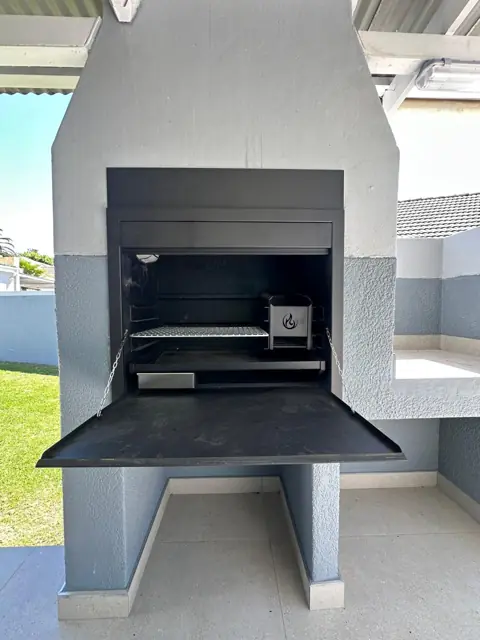 Built-in braai with the front door open and the grid in place, Durbanville