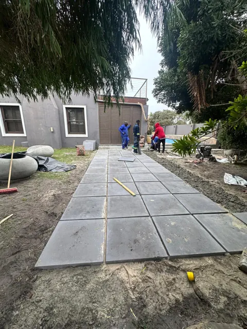 Our team laying the paved garden path