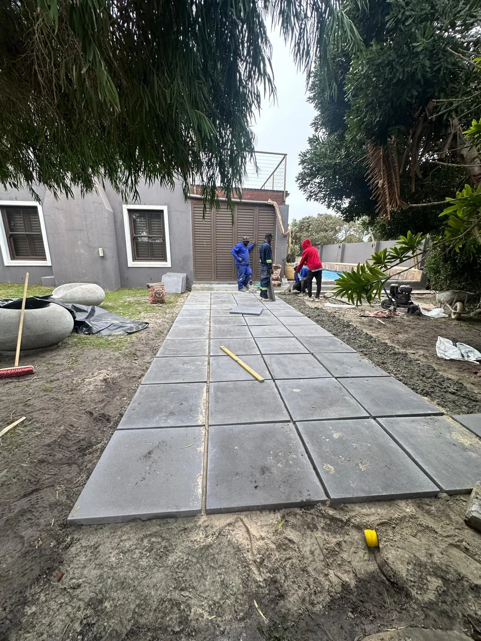 Our team laying a paved garden path