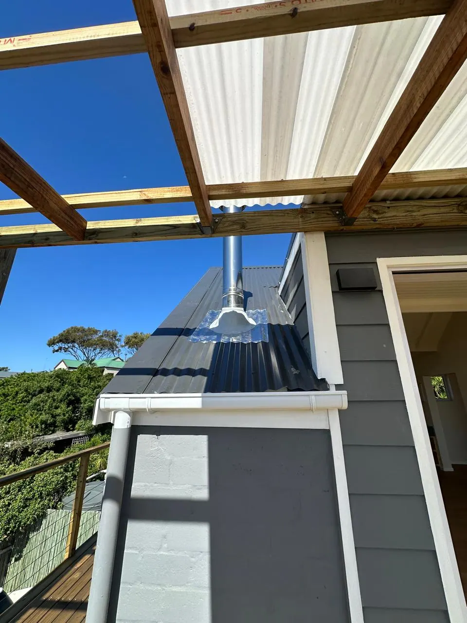 Exterior flue run beside the pergola, Imhofs Gift Kommetjie