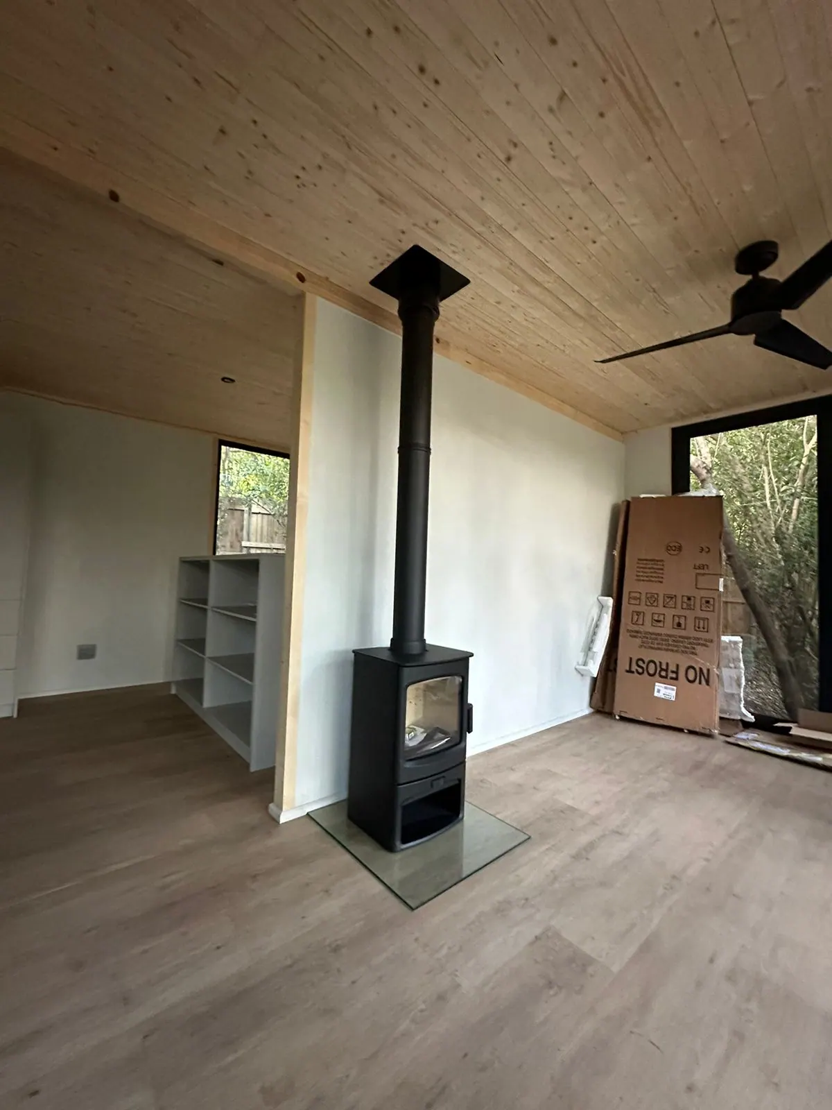 Freestanding stove with full flue run to the timber ceiling, Noordhoek