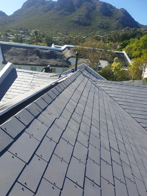 Roof painted dark grey with the Hout Bay mountains in the background