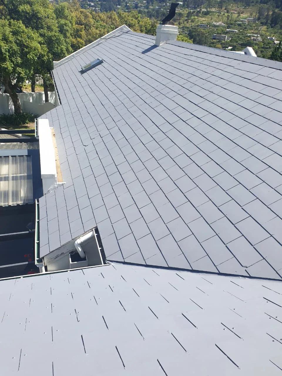 Grey painted roof sections with skylights on a Hout Bay home