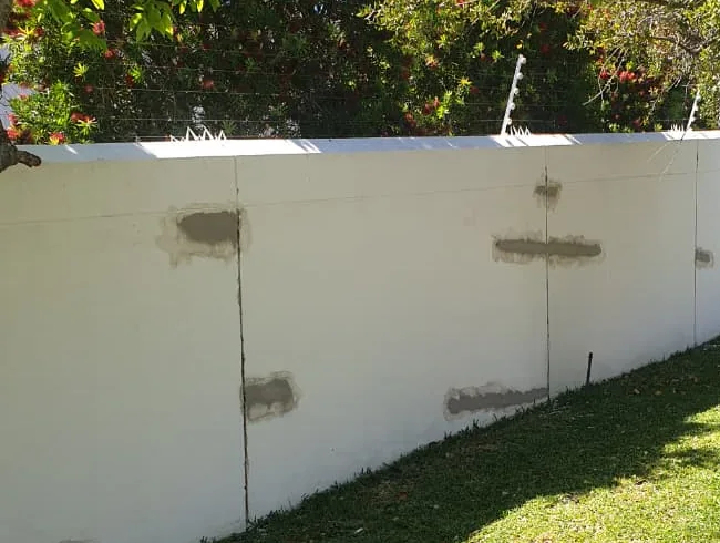 Plastered wall with crack repairs patched and ready for paint in Hout Bay
